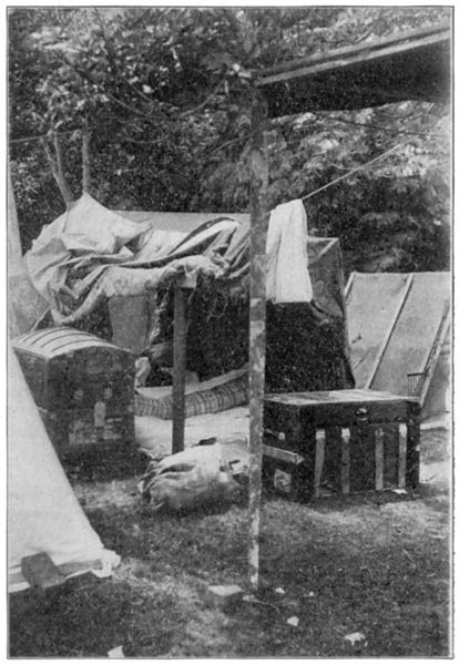 Personal Belongings Gathered on the Front Lawn of a Destroyed House