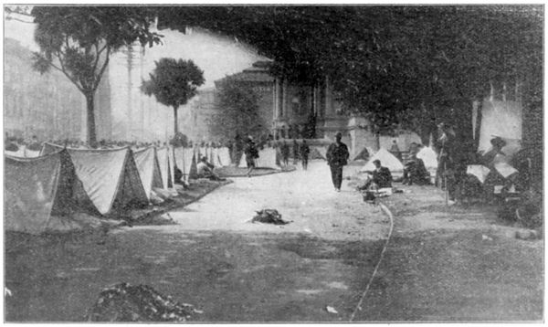 People Living in Tents in a Public Square