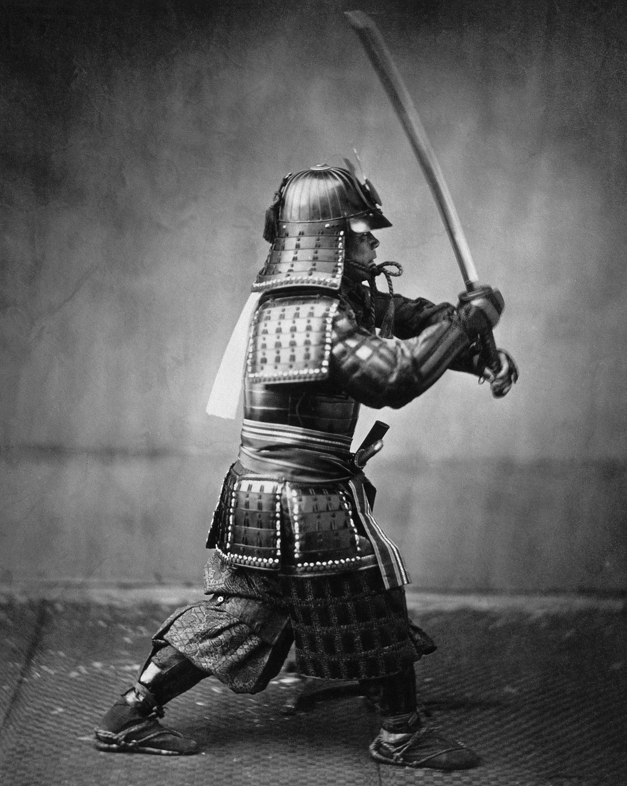 Samurai armed with a sword and wearing armor.