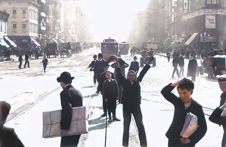 Boys waving to the camera on Market Street, San Francisco1906