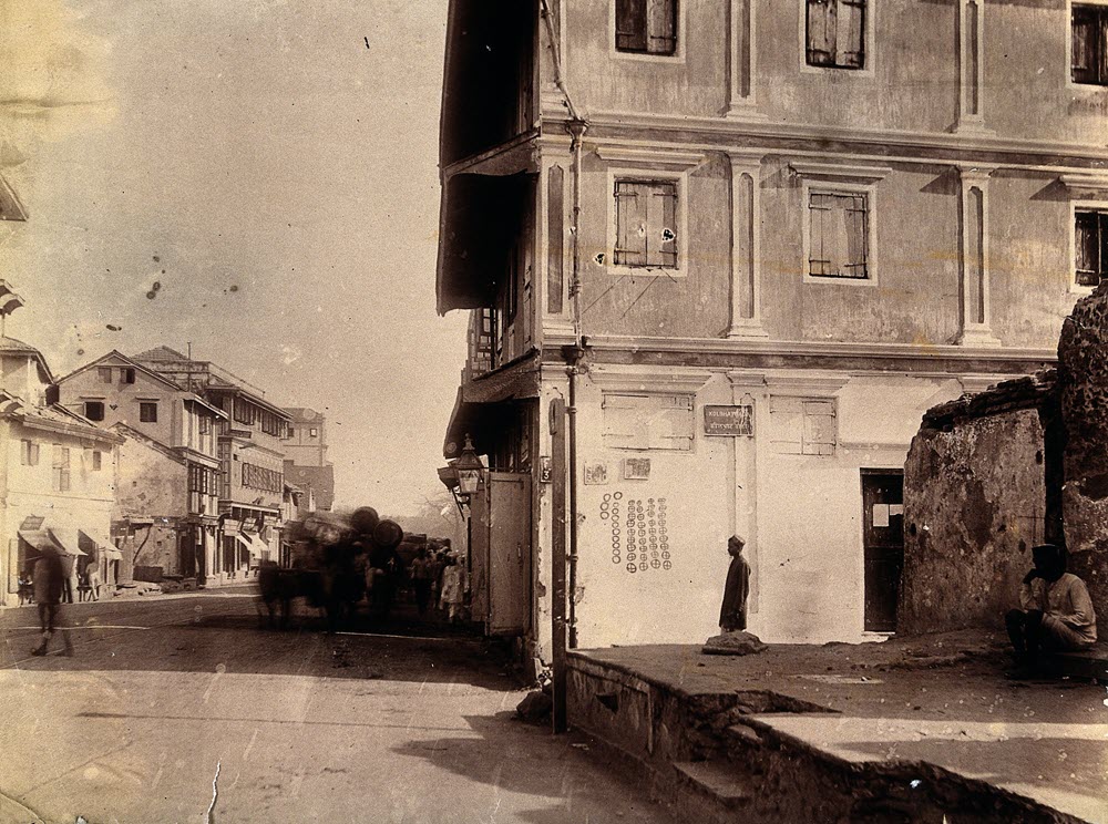 Photograph of a house in Bombay India with plague circles marking the number of deaths